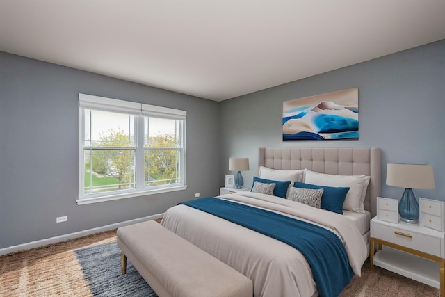 bedroom with carpet and baseboards