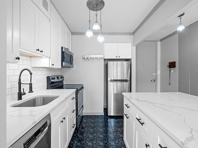 100 E Walton St Unit 18G, Chicago, IL 60611 - kitchen with stainless steel appliances, a sink, tasteful backsplash, pendant lighting, and white cabinetry