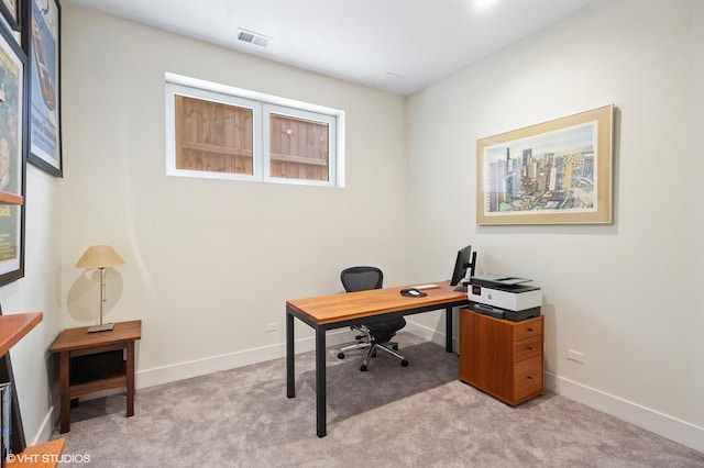 office space with light colored carpet and baseboards