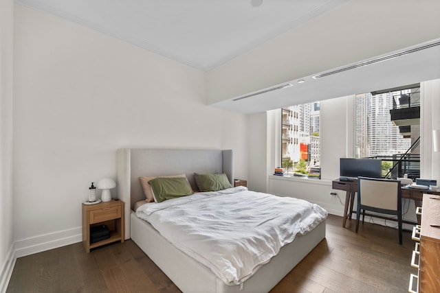 435 N Michigan Ave Unit 416, Chicago, IL 60611 - bedroom with dark wood finished floors, baseboards, an office area, and crown molding