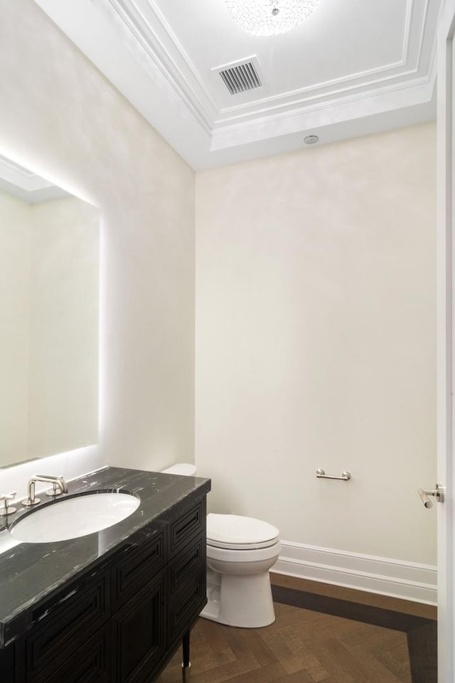 435 N Michigan Ave Unit 416, Chicago, IL 60611 - bathroom featuring a tray ceiling, toilet, vanity, crown molding, and baseboards