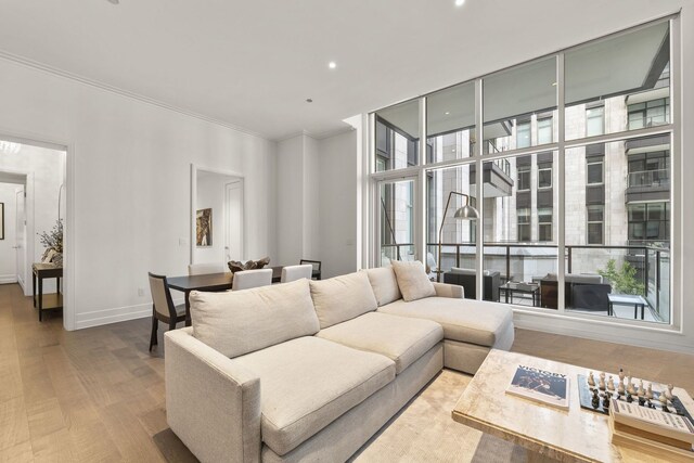 435 N Michigan Ave Unit 416, Chicago, IL 60611 - living room featuring ornamental molding, wood finished floors, baseboards, recessed lighting, and floor to ceiling windows