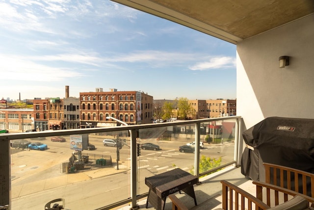 balcony featuring area for grilling and a city view