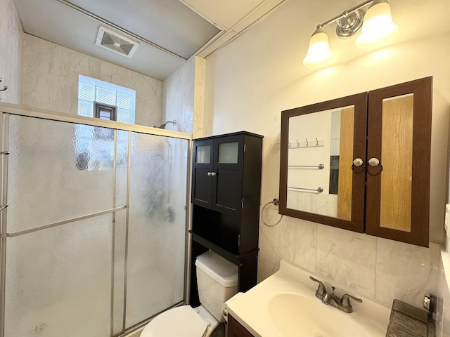 3328 S Oakley Ave, Chicago, IL 60608 - bathroom with vanity, toilet, decorative backsplash, and a shower stall