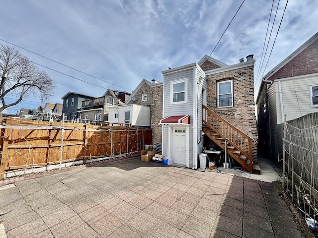 3328 S Oakley Ave, Chicago, IL 60608 - back of house with a patio area, a residential view, a fenced backyard, and stairs