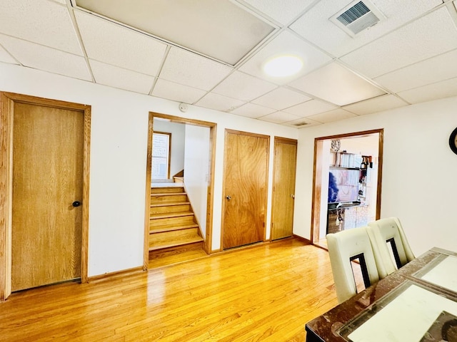 3328 S Oakley Ave, Chicago, IL 60608 - dining room featuring a paneled ceiling, stairs, light wood-type flooring, and visible vents