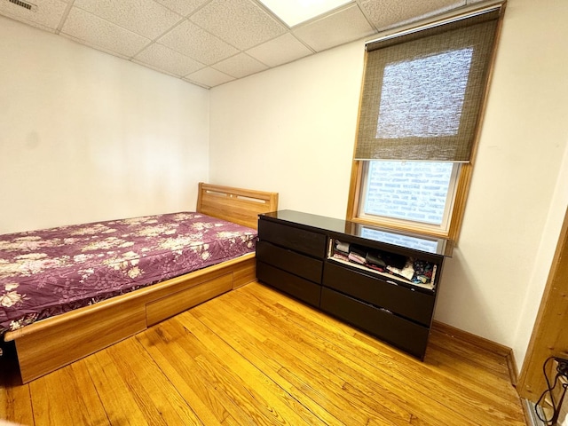 3328 S Oakley Ave, Chicago, IL 60608 - bedroom featuring a drop ceiling, light wood-style floors, and visible vents