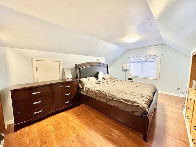 3328 S Oakley Ave, Chicago, IL 60608 - bedroom featuring light wood-type flooring, vaulted ceiling, and baseboards