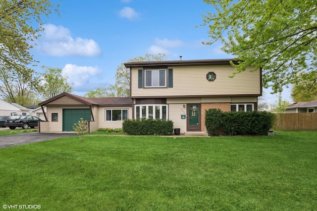 2404 Meadow Dr, Rolling Meadows, IL 60008 - view of front of home with an attached garage and asphalt driveway