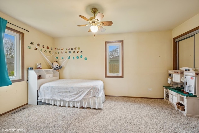 2404 Meadow Dr, Rolling Meadows, IL 60008 - bedroom featuring light carpet, baseboards, and ceiling fan