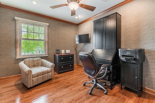 office with crown molding, light wood-style flooring, a ceiling fan, and baseboards