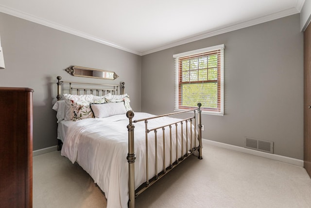 bedroom with light carpet, baseboards, and ornamental molding