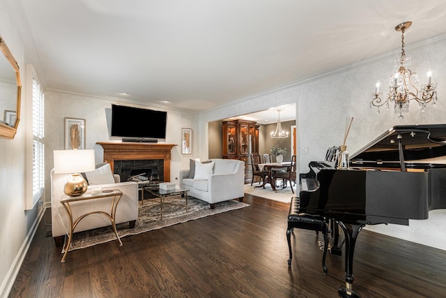 living room with a chandelier, dark wood-style floors, a fireplace, and crown molding