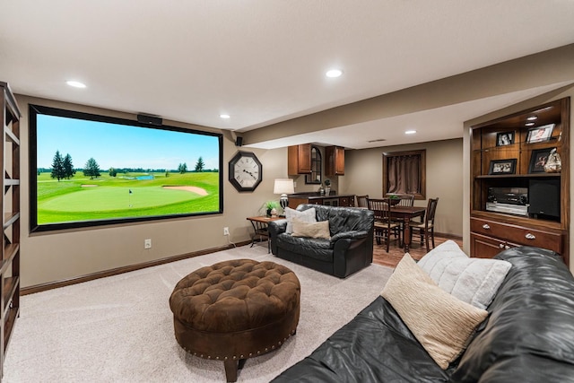 home theater room with baseboards, light carpet, and recessed lighting