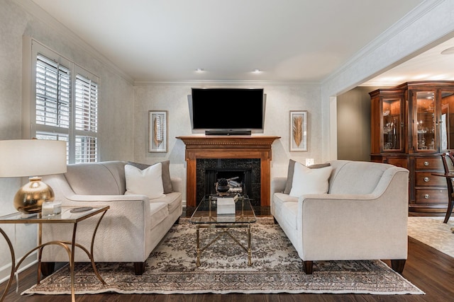 living area featuring crown molding, a high end fireplace, and dark wood finished floors