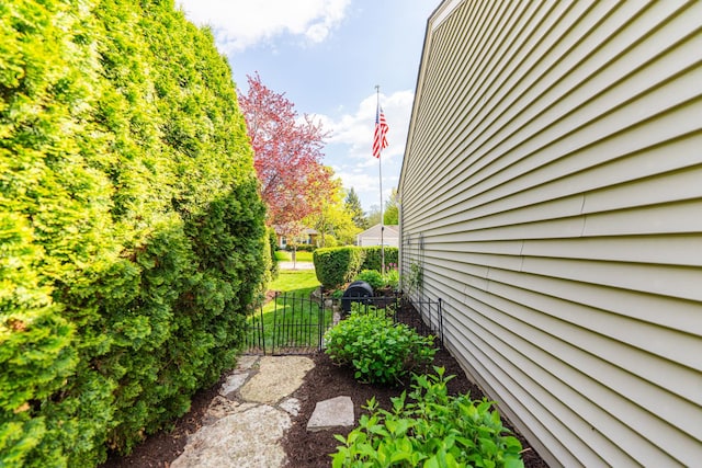 view of home's exterior with fence
