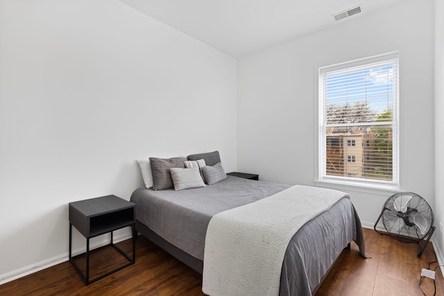 6452 N Glenwood Ave Unit 3, Chicago, IL 60626 - bedroom with dark wood finished floors, multiple windows, and baseboards