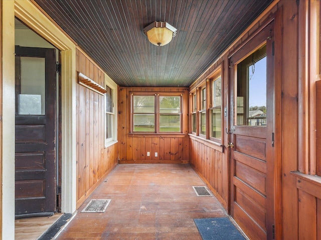 unfurnished sunroom with visible vents