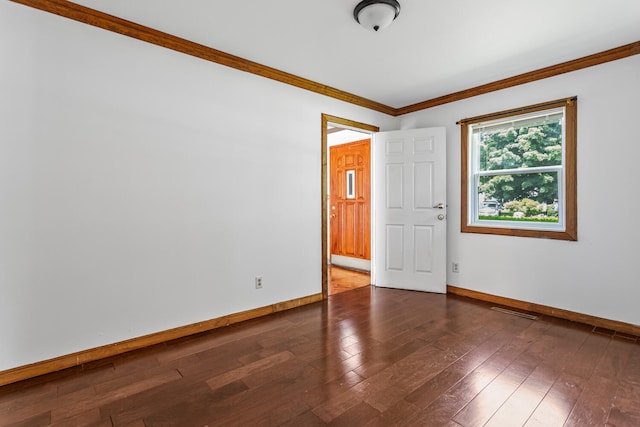 2503 Maplewood Dr, Champaign, IL 61821 - unfurnished room with baseboards, wood-type flooring, and ornamental molding