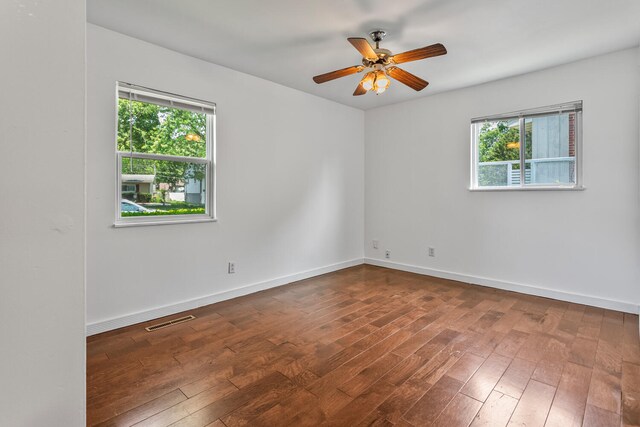 2503 Maplewood Dr, Champaign, IL 61821 - unfurnished room with plenty of natural light, hardwood / wood-style floors, baseboards, and ceiling fan