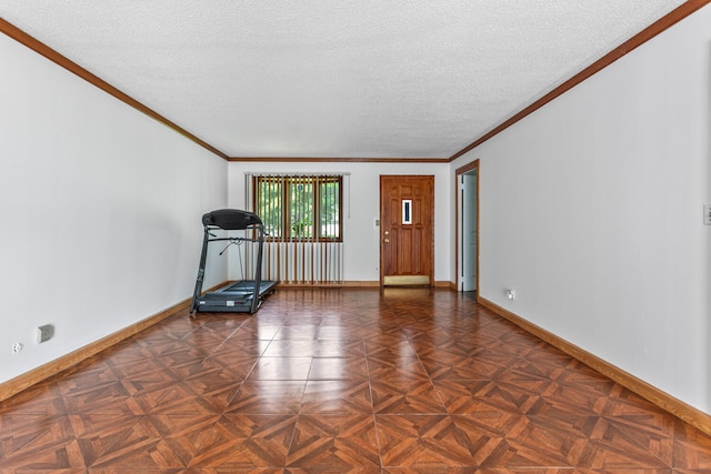 2503 Maplewood Dr, Champaign, IL 61821 - foyer entrance with baseboards, a textured ceiling, and ornamental molding