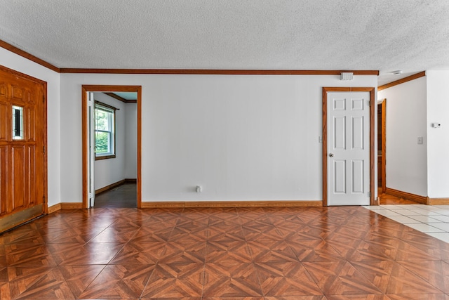 2503 Maplewood Dr, Champaign, IL 61821 - unfurnished room with a textured ceiling, ornamental molding, and baseboards