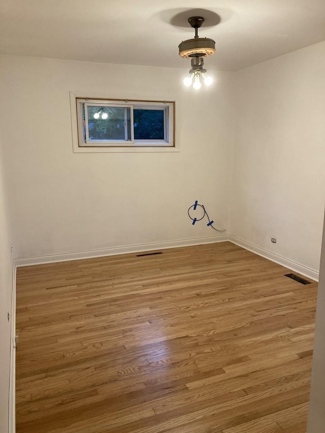 303 N School St, Mount Prospect, IL 60056 - empty room with wood finished floors and baseboards