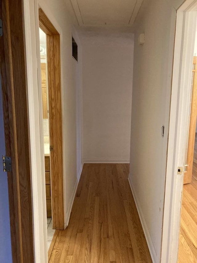 303 N School St, Mount Prospect, IL 60056 - hallway with attic access, light wood-style flooring, and baseboards