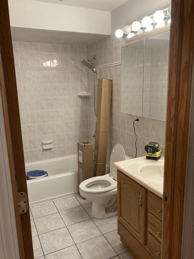 303 N School St, Mount Prospect, IL 60056 - bathroom with tile patterned floors, tile walls, toilet, vanity, and washtub / shower combination