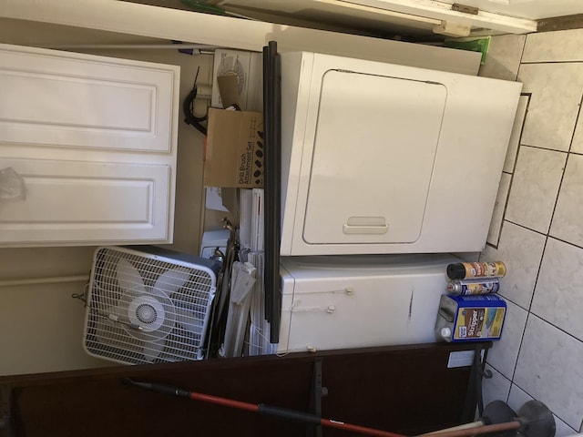 laundry area with laundry area and stacked washer and dryer