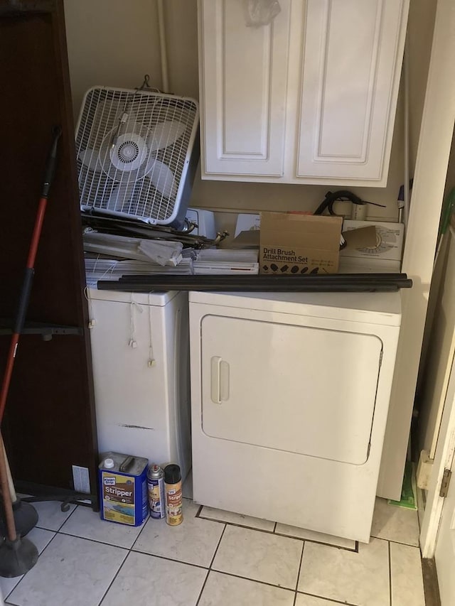 303 N School St, Mount Prospect, IL 60056 - laundry area featuring washer / clothes dryer, light tile patterned floors, and cabinet space