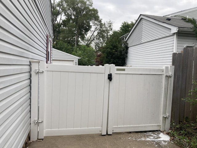 view of gate with fence