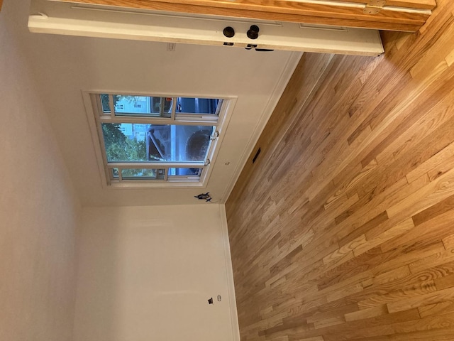 unfurnished room with wood walls