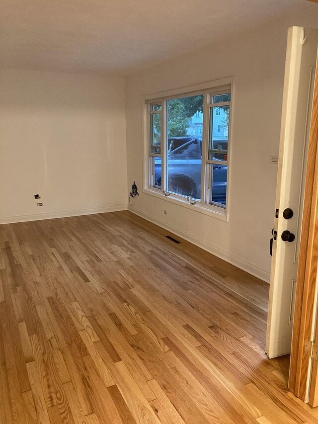 303 N School St, Mount Prospect, IL 60056 - empty room featuring light wood finished floors and baseboards