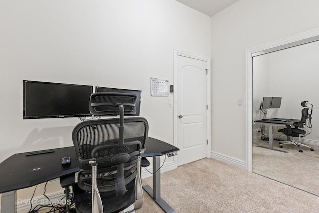 carpeted office space with baseboards