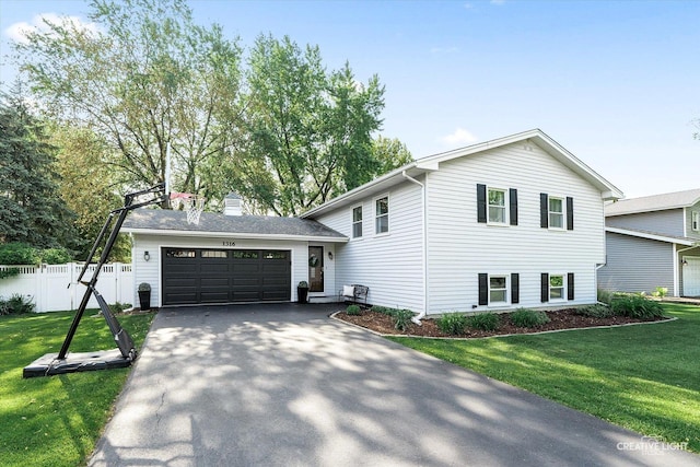 1316 Carol Ln, Naperville, IL 60565 - tri-level home featuring an attached garage, driveway, and a chimney
