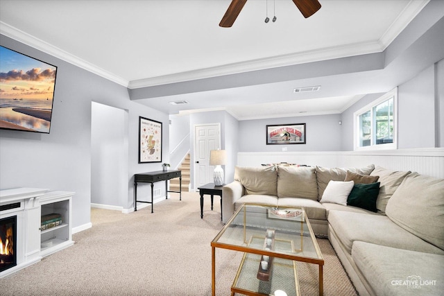 1316 Carol Ln, Naperville, IL 60565 - living room with crown molding, stairway, light carpet, a ceiling fan, and a lit fireplace