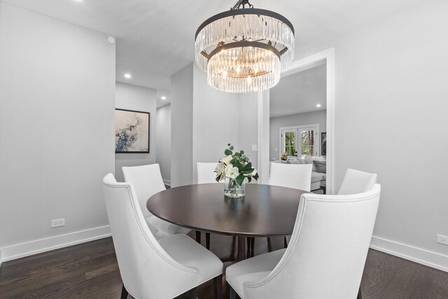 15 Reliance Ln, Lincolnshire, IL 60069 - dining space with dark wood finished floors, a chandelier, baseboards, and recessed lighting