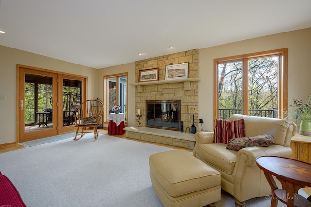 living room with plenty of natural light, a fireplace, and recessed lighting
