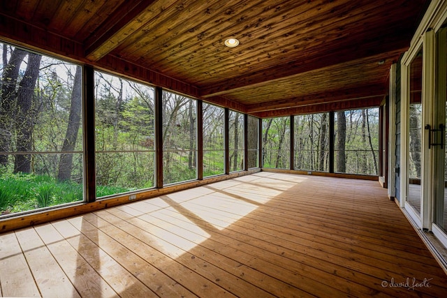 unfurnished sunroom featuring wooden ceiling and hardwood / wood-style flooring