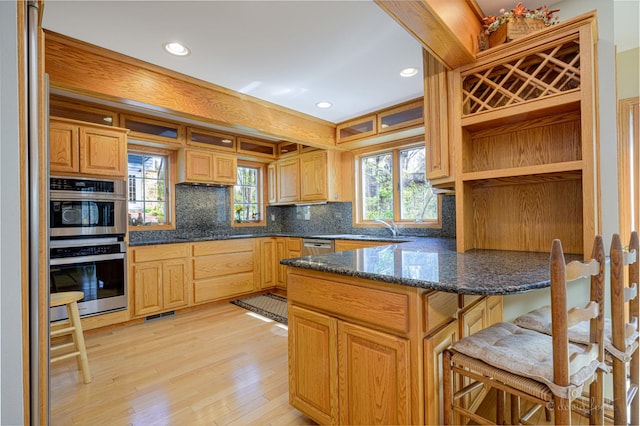 kitchen featuring open shelves, decorative backsplash, a peninsula, recessed lighting, and light wood-type flooring