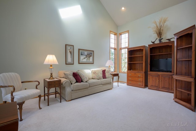 living room with light carpet, high vaulted ceiling, recessed lighting, and baseboards