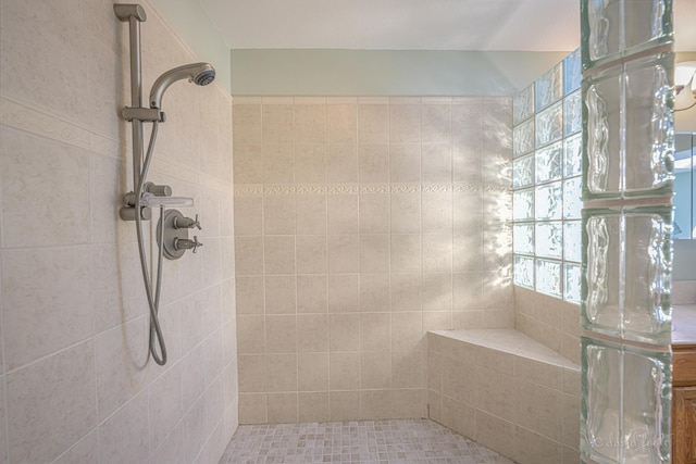 full bathroom with tiled shower