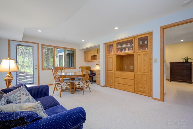 dining room with recessed lighting, light colored carpet, and baseboards