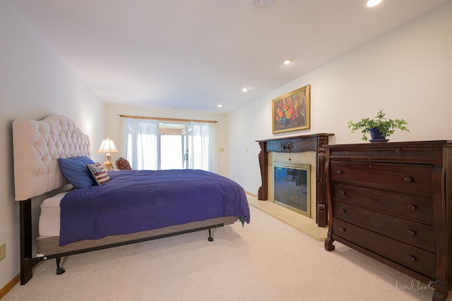 bedroom with light carpet, a fireplace, recessed lighting, and baseboards