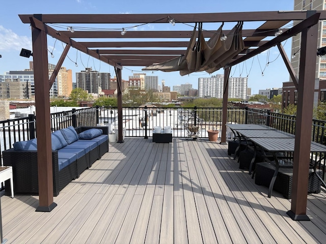 deck featuring a city view, an outdoor hangout area, and outdoor dining space