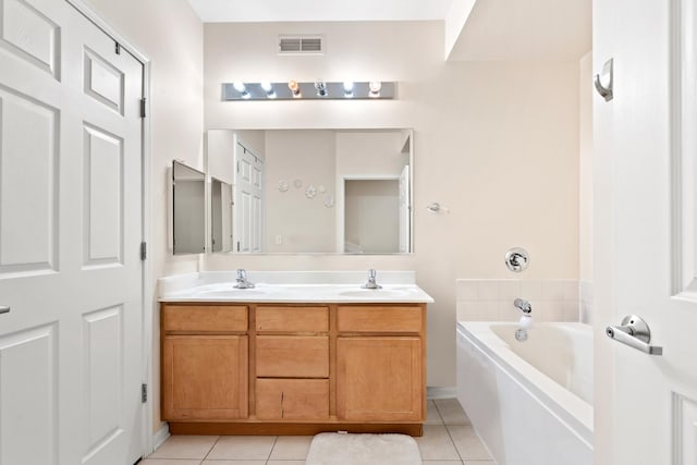 bathroom featuring a sink, visible vents, and tile patterned floors