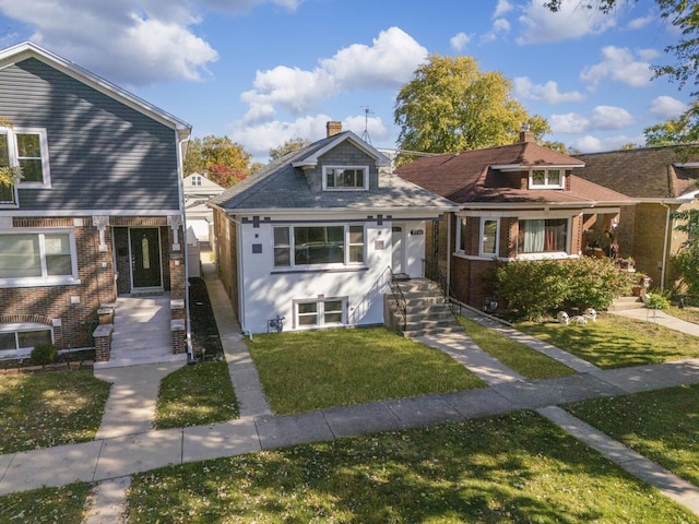 7732 W Sunset Dr, Elmwood Park, IL 60707 - bungalow with a front lawn, central AC unit, and a chimney