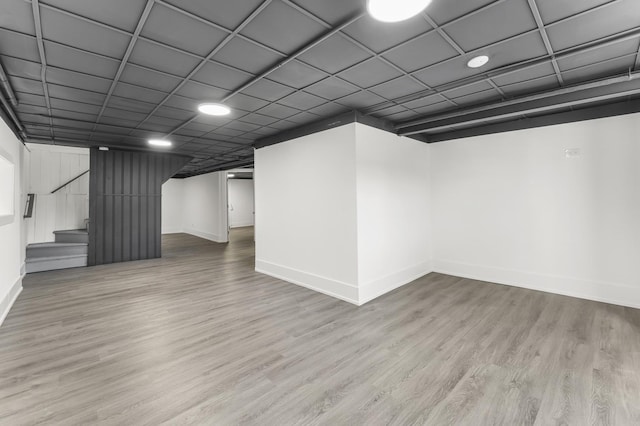 7732 W Sunset Dr, Elmwood Park, IL 60707 - finished basement featuring wood finished floors, baseboards, and stairs