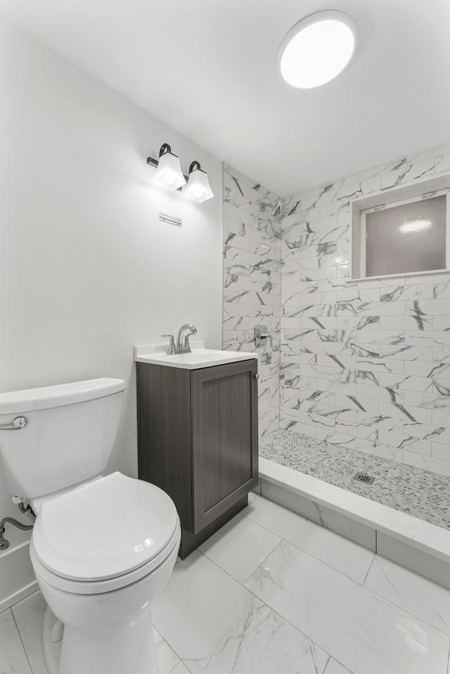 7732 W Sunset Dr, Elmwood Park, IL 60707 - bathroom with vanity, toilet, marble finish floor, and a tile shower
